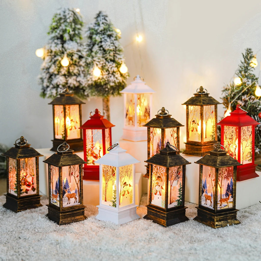 A group of small Christmas scene lanterns lit up among frosted trees