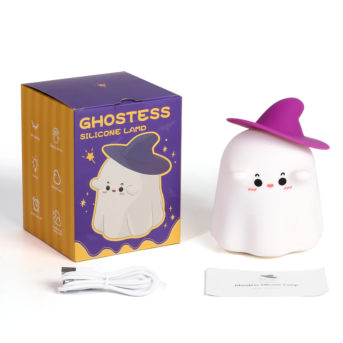 Ghost silicone night light in a witch hat next to its gift box and USB cable