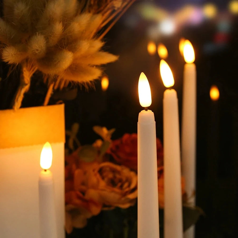 Close up of the warm flickering LED flame on the taper candles