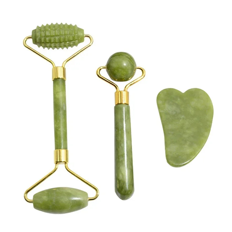 The three pieces of the jade set: double roller, textured roller and gua sha stone