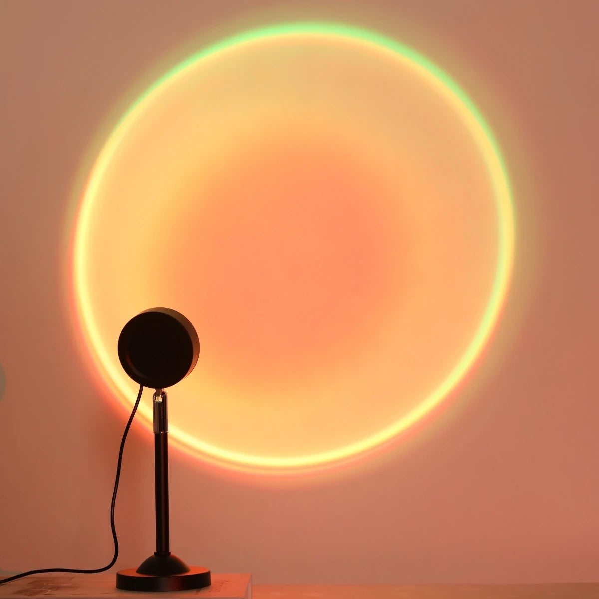 Sunset projection lamp casting a warm orange sun disc on a wall