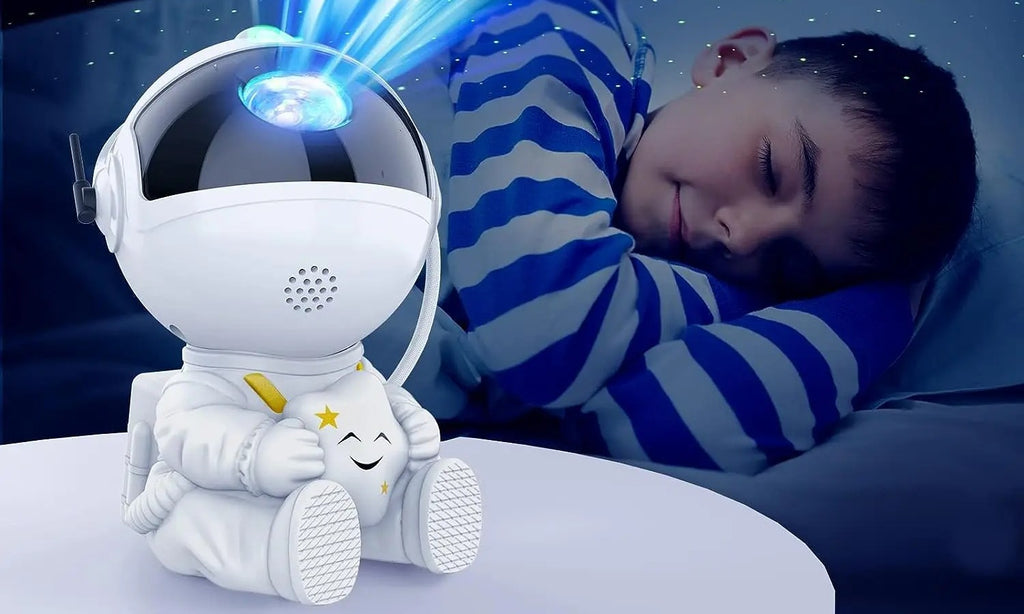 White astronaut galaxy projector glowing on a bedside table while a child sleeps